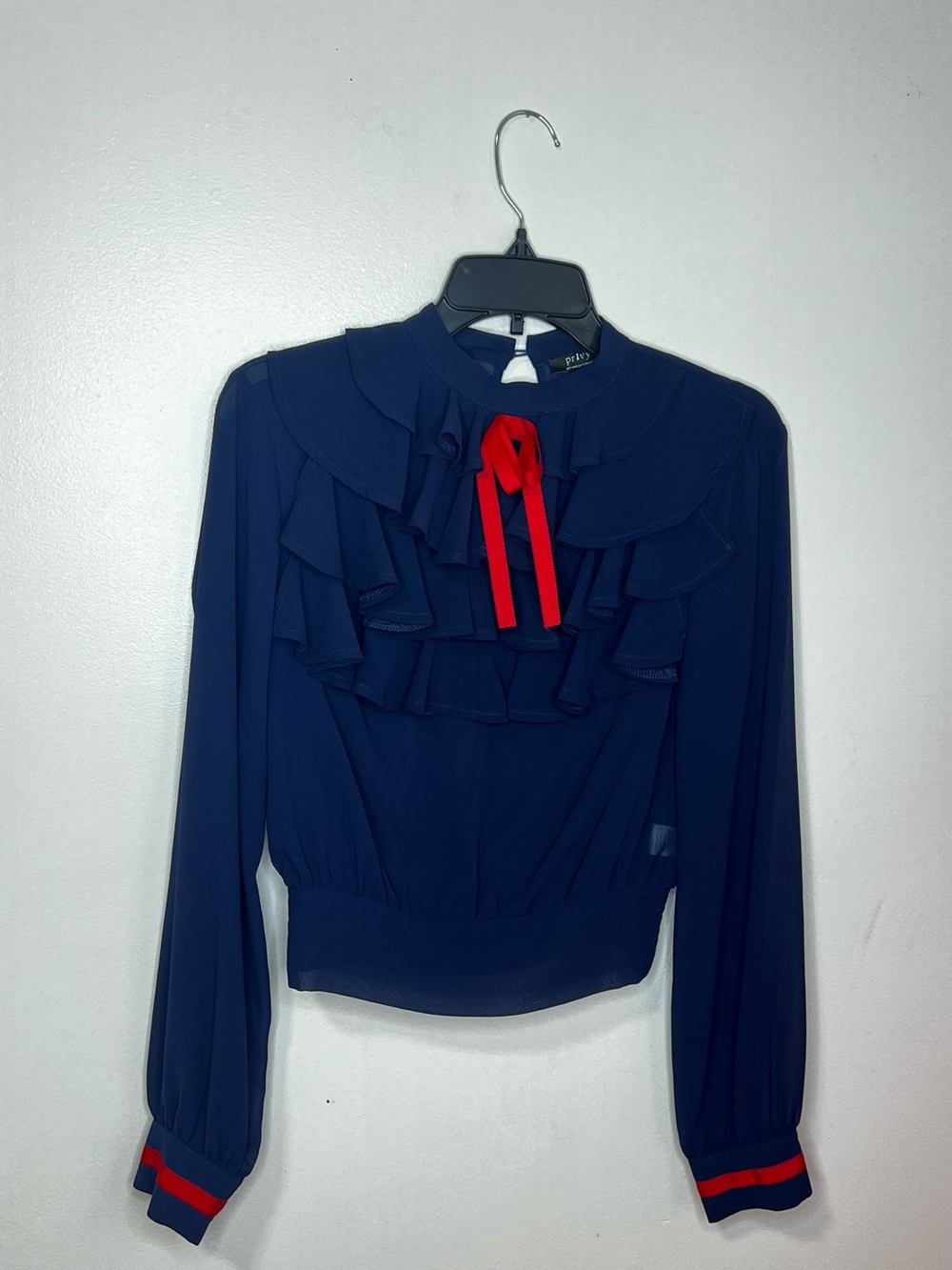 privy Navy Ruffle Tie-Neck Blouse with Red Accent